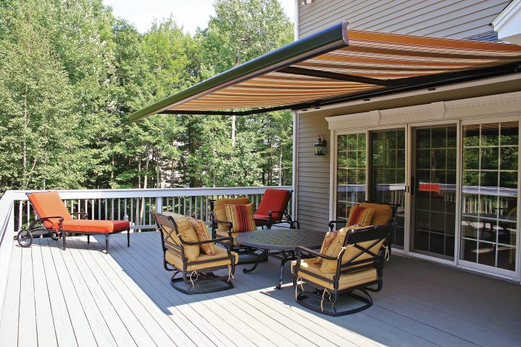 Automatic retractable sun shade extended over a patio in Central Florida providing UV protection and outdoor shade